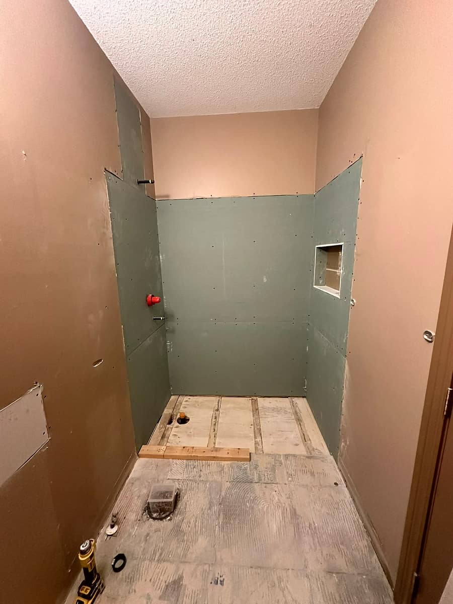 Bungalow Home Renovation — walk-in shower walls prepared for waterproofing and tile