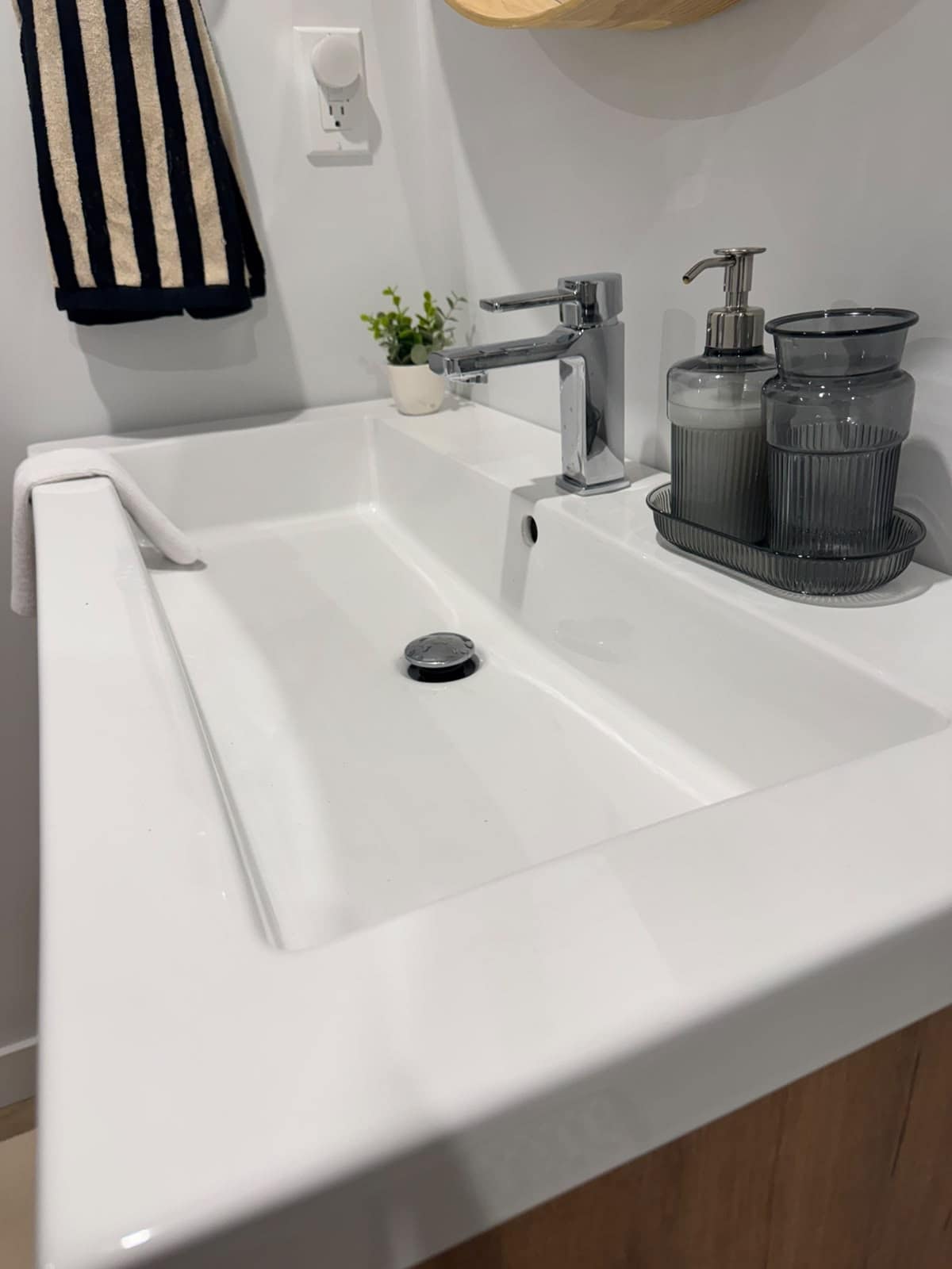 Finished bathroom vanity, sink and fixtures by Cadavid Solutions